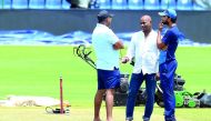 Sri Lankan chief cricket selector Sanath Jayasuriya (centre) speaks with Sri Lankan cricket team manager Asanka Gurusinghe (left) and Sri Lankan captain Dinesh Chandimal at the Pallekele International Cricket Stadium in Pallekele.