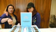 Warby Parker employees unfold pairs of solar eclipse glasses in New York City. To view the upcoming total solar eclipse on August 21 eye protection is essential. The designer eyeglass store expects to give out thousands of the glasses before the event