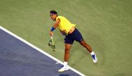 Rafael Nadal of Spain serves to Nick Kyrgios of Australia during Day 7 of the Western and Southern Open at the Linder Family Tennis Center on August 18, 2017 in Mason, Ohio. Rob Carr/Getty Images/AFP
