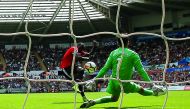 Manchester United’s Romelu Lukaku scores their second goal against Swansea City during their English Premier League match yesterday.