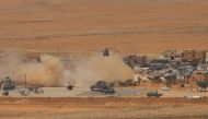 A general view taken on August 20, 2017, shows a military helicopter landing at a Lebanese military base in a mountainous area near the eastern town of Ras Baalbek, as Lebanese troops launched an offensive against the Islamic State group on the country's 