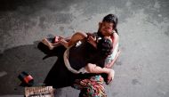 A Filippina called Jennelyn Olaires, 26, cradles the body of her partner who was killed on a street by a vigilante group according to police in a spate of drug related killings in Pasay city, Metro Manila . (Reuters / Czar Dancel) 