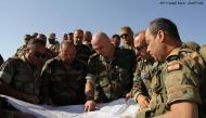A handout picture released by the Lebanese Army on August 20, 2017, shows Army Commander Joseph Aoun (C) speaking soldiers in Ras Baalbek during an operation against jihadist fighters.

