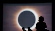 Children watch a presentation about the eclipse during a drive-in movie at the Historic Columbia Speedway August 20, 2017 in Columbia, South Carolina.  Sean Rayford/AFP