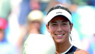Garbine Muguruza of Spain poses with the winner’s trophy after defeating Simona Halep of Romania during the women’s final of Cincinnati Open on Sunday.