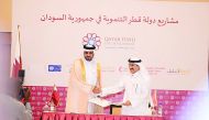 QFFD General Manager, Khalifa Jassim Al Kuwari, and QRCS Secretary-General, Ali Hassan Al Hammadi, during the MoU signing ceremony. 