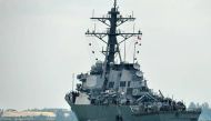 A general view of the USS John S McCain with a hole on its port side, outside Changi naval base in Singapore on Aug 21, 2017. (Photo: AFP/Roslan Rahman).