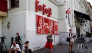 Journalists gather outside the Gogol Centre theatre in Moscow on August 22, 2017. Russia's Investigative Committee said on August 22, 2017 that it had detained Kirill Serebrennikov, film director and Moscow's Gogol Centre theatre artistic director, on sus