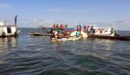 Rescuers search on August 23, 2017 for bodies of missing passengers from a boat carrying 70 passengers that capsized Tuesday night while sailing on the Xingu river from Santaren to Vitoria do Xingu in the northern Brazilian state of Para, killing at least