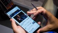 A man tries the new Samsung Galaxy Note8 smartphone during a launch event, August 23, 2017 in New York City. (Drew Angerer/Getty Images/AFP)