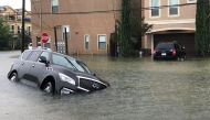A vehicle sits half submerged in flood waters in a residential area in the aftermath of Hurricane Harvey in Houston, Texas, U.S., August 27, 2017. REUTERS/Ernest Scheyder
