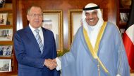 Kuwaiti Foreign Minister, Sheikh Sabah al-Khaled al-Sabah (R) shaking hands with his Russian counterpart Sergey Lavrov following a meeting in Kuwait City. KUNA 
