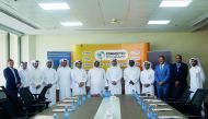 Officials of Qatar Post and the Civil Aviation Authority at the MoU signing ceremony at the Qatar Post Main Building.