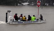 A Sheriff Dept boat rescues people after Hurricane Harvey caused heavy flooding in Houston, Texas on August 28, 2017. Rescue teams in boats, trucks and helicopters scrambled Monday to reach hundreds of Texans marooned on flooded streets in and around the 