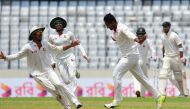 Bangladeshi cricketer Shakib Al Hasan (C) reacts after the dismissal of Australian cricketer Glenn Maxwell (R) during the fourth day of the first Test cricket match between Bangladesh and Australia at the Sher-e-Bangla National Cricket Stadium in Dhaka on