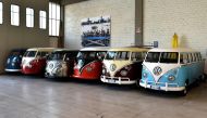 Vintage Volkswagen Kombi bus are parked in a garage after being completly restored by mechanics of the T1 specialist company on November 3. 2016 in Florence (AFP)
