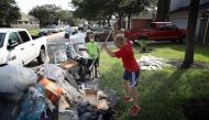 Dickinson residents discard possessions damaged by flooding brought on by Hurricane Harvey September 1, 2017 in Dickinson, Texas. (Win McNamee/Getty Images/AFP)