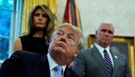 U.S. first lady Melania Trump, Vice President Mike Pence and U.S. President Donald Trump receive an update on Hurricane Harvey recovery efforts at the White House in Washington, U.S., September 1, 2017. (REUTERS/Kevin Lamarque)