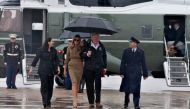 US President Donald Trump and First Lady Melania Trump board Air Force One on September 2, 2017, at Andrews Air Force Base in Maryland. The Trumps are traveling to Texas and Lousiana to assess conditions in the storm-ravaged states. (AFP / Nicholas Kamm)