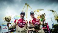Qatar’s Al Attiyah and French navigator Matthieu Baumel celebrate after winning the ORLEN Baja in Szczecin, Poland yesterday.