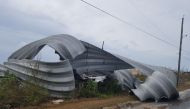 This handout photograph obtained courtesy of the Royal Bahamas Police Force & Royal Bahamas Defense Force shows a damaged structure near the shore of Inagua in the southern Bahamas, September 8, 2017 following passage of Hurricane Irma. AFP / Royal Bahama