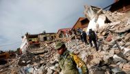 Soldiers work to remove the debris of a house destroyed in an earthquake that struck off the southern coast of Mexico late on Thursday, in Juchitan, Mexico, September 8, 2017. REUTERS/Edgard Garrido
