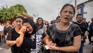 Relatives of German Torres morn during a funeral of victim of the 8.2 magnitude earthquake that hit Mexico's Pacific coast, in Juchitan de Zaragoza, state of Oaxaca, September 9, 2017. AFP / Victoria Razo