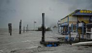 Rough surf churned up buy the approaching hurricane damage the docks at Whale harbour in the Florida Keys as winds and rain from the outer bands of Hurricane Irma arrive in Islamorada, Florida on September 9, 2017.  AFP / Gaston De Cardenas
