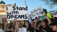LAS VEGAS, NV: Immigrants and supporters chant outside the New York-New York Hotel & Casino on the Las Vegas Strip during a 