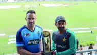 Pakistani cricket captain Sarfraz Ahmad (right) and International World XI captain Faf du Plessis hold the Independence Cup trophy during a press conference at the Gaddafi Cricket Stadium in Lahore, yesterday. 