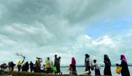 Rohingya Muslim refugees arrive from Myanmar after crossing the Naf river in the Bangladeshi town of Teknaf on September 12, 2017. AFP / Munir Uz Zaman