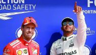 Mercedes driver Lewis Hamilton (right) celebrating his pole position next to second placed Ferrari driver Sebastian Vettel after the qualifying session at the Spa-Francorchamps circuit in Spa ahead of the Belgian Formula One Grand Prix in the August 2017 
