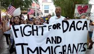 Nevada Senate Majority Leader Aaron D. Ford (D-Las Vegas) (3rd L) joins immigrants and supporters as they march on the Las Vegas Strip during a 