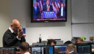 Traders at BGC Partners look at screens as victorious US Presidential election candidate Donald Trump speaks CREDIT: TOBY MELVILLE/REUTERS.