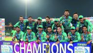 Pakistani cricketers pose for a photograph with trophy after winning the third and final Twenty20 International match against World XI at the Gaddafi Cricket Stadium in Lahore, yesterday. 