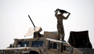 File photo: A fighter of Syrian Democratic Forces (SDF) is seen in the eastern part of Deir al Zor, Syria September 12, 2017.REUTERS/Rodi Said Reuters.