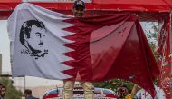 Qatari rally driver Nasser Saleh Al Attiyah pose for a photograph after winning the Shiraz International Rally in south-central Iran, on Friday.