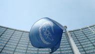 (file Photo) The flag of the International Atomic Energy Agency (IAEA) flies in front of its headquarters in Vienna, Austria, May 28, 2015. REUTERS/Heinz-Peter Bader