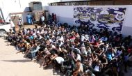 Sudanese migrants sit at a detention center before their voluntary return to their country, in Tripoli, Libya September 14, 2017. REUTERS/Hani Amara

