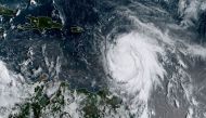 This satellite image obtained from the National Oceanic and Atmospheric Administration (NOAA) shows Hurricane Maria at 1215 UTC on September 18, 2017. AFP / NOAA/RAMMB