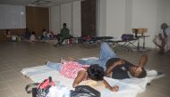 People take refuge in an hurricane shelter on September 19, 2017, in La Savane, on the French Caribbean island of Saint-Martin, after it was hit by Hurricane Irma and as the island prepares to step up its alert level ahead of the arrival of Hurricane Mari