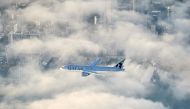 Qatar Airways flight 920 soars through the clouds over Auckland (Photo: Qatar Airways)
