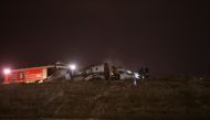 Firefigters stand next to the wreckage of a private jet after it crashed at Ataturk airport in Istanbul, Turkey, September 21, 2017. Reuters/Osman Orsal