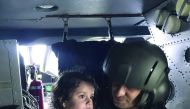 A wounded migrant girl is being taken to hospital after a fishing vessel carrying illegal migrants sank in the Black Sea off Turkey’s northwestern province of Kocaeli, yesterday.
