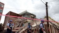 Rescue workers take part in the search for survivors at the Enrique Rebsamen elementary school in Mexico City on September 22, 2017, three days after a strong quake hit central Mexico.  AFP / Diana Ulloa