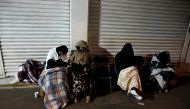 People sleep on the sidewalk next to a collapsed building after an earthquake as they wait for news of their loved ones in Mexico City, Mexico September 24, 2017. Reuters/Henry Romero