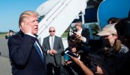 US President Donald Trump speaks with reporters while boarding Air Force One at Morristown Airport September 24, 2017 in Morristown, New Jersey. AFP / Brendan Smialowski