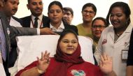 (FILES) This file photo taken on July 24, 2017 shows Egyptian national Eman Ahmed Abd El Aty waving during a press conference at the Burjeel Hospital in Abu Dhabi. AFP / Saeed BASHAR
