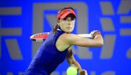 Alize Cornet of France hits a return against Anastasia Pavlyuchenkova of Russia during their first round women’s match at the WTA Wuhan Open tennis tournament in Wuhan, in China’s central Hubei province, yesterday.