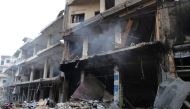Destruction is seen following a reported Russian air strike in the district of Jisr al-Shughur, in the Idlib province, on September 25, 2017. AFP / Mohamed al-Bakour
